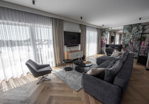 TV a/nebo společenská místnost v ubytování Lazur Apartamenty Domki
