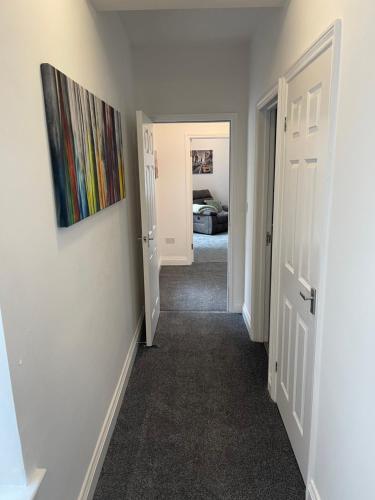 a hallway with a hallway leading to a bedroom at Washington Village Apartment in Washington