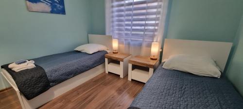 Postel nebo postele na pokoji v ubytování Apartament Cumulus