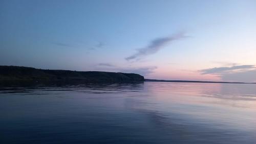 a view of a body of water at sunset at Holiday Stone House - Fumarea in Rtina