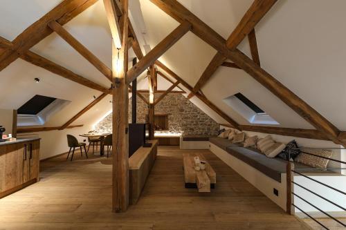 a loft conversion with a bed and a table at Couleur basilic in Rochefort
