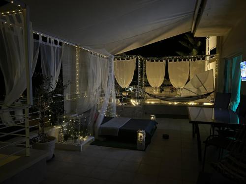 a room with a bed and a table with lights at Delphitea Philoxenia in Itea