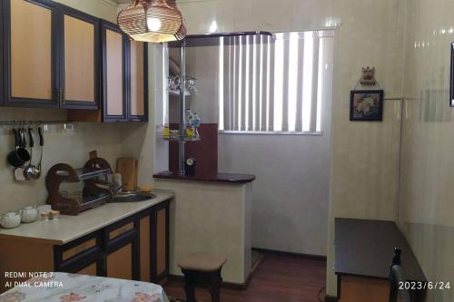 a kitchen with a sink and a counter top at Elegant Condo next to Bazaar, close to the metro station, 9 in Tashkent