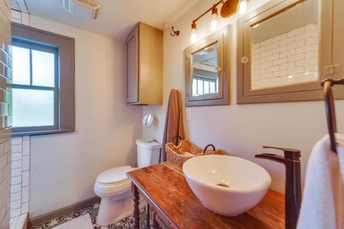 a bathroom with a sink and a toilet at Renovated Lubbock Home - Walk to Texas Tech! in Lubbock