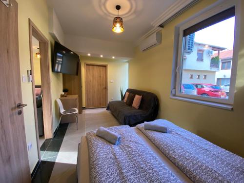 Postel nebo postele na pokoji v ubytování NEST1 Apartments