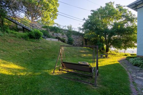a swing in the grass in a yard at Dubuque's Front Porch, Historic Charmer, Walk Downtown in Dubuque