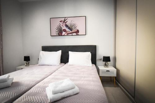 Postel nebo postele na pokoji v ubytování Nefeli Apartment