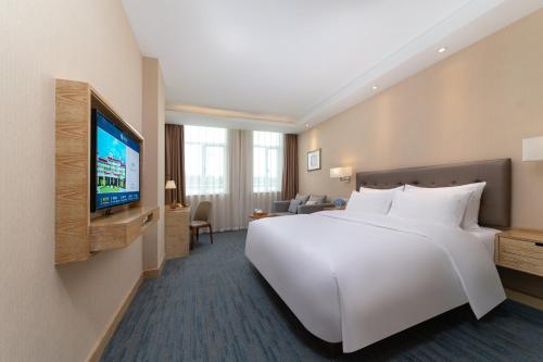 Katil atau katil-katil dalam bilik di Xiamen Xiang An Yi Hao Hotel