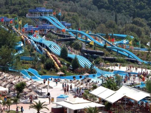 a large water park with a water slide at painter's house in Agios Ioannis