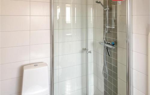 a bathroom with a shower with a glass door at Cozy Home In Simrishamn With Wifi in Simrishamn