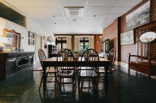 a dining room with a table and chairs at Mister Rice in Castlemaine