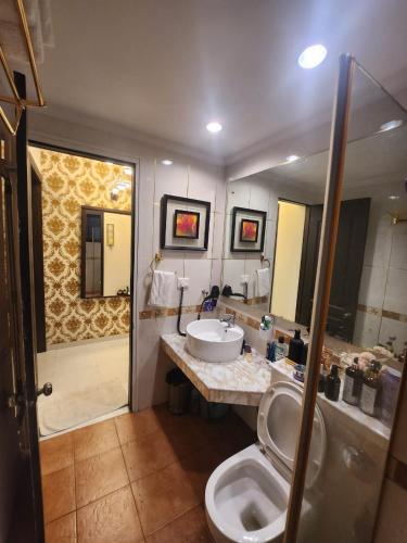 a bathroom with a sink and a toilet at Luxury Stay at GOA in Anjuna