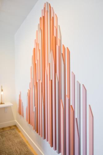 a wall mural of orange lines on a wall at Skyview Hotel in Torrey