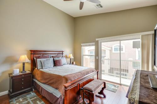 a bedroom with a bed and a balcony at Las Vegas Vacation Rental with Pool Access in Las Vegas