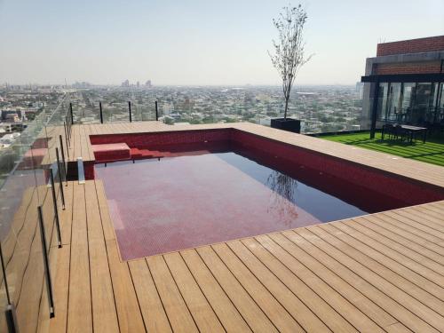 a swimming pool on top of a building at Ecovergel Santa Lucia in Monterrey