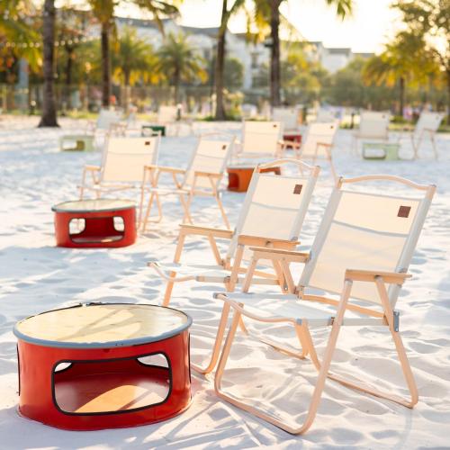 a group of chairs and a table in the sand at Apartment 1BR-FL25th-R103 Building-Vinhomes Ocean Park in Hanoi
