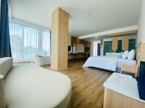 a large bedroom with a bed and a bath room at Infinity Aonang Krabi in Ao Nang Beach