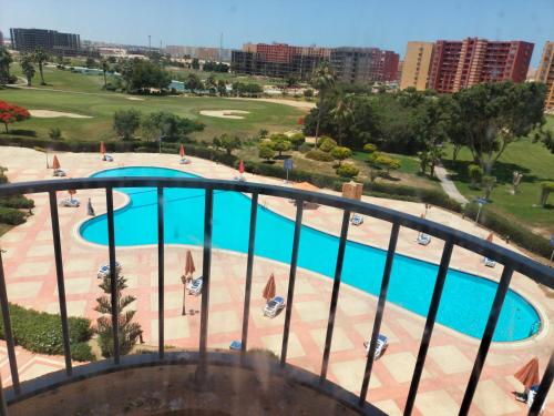 a view of a swimming pool from a balcony at جولف بورتو مارينا in El Alamein