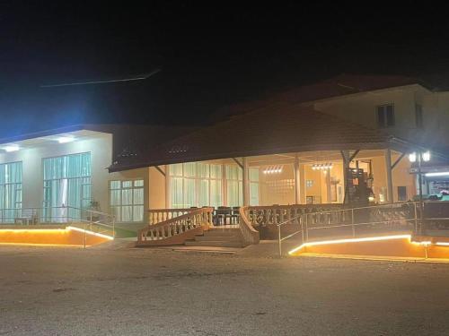 a building at night with lights in front of it at Blackstone Beach Resort in Kuantan