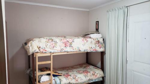 a bedroom with two bunk beds in a room at Complejo Las chacras in Juana Koslay 