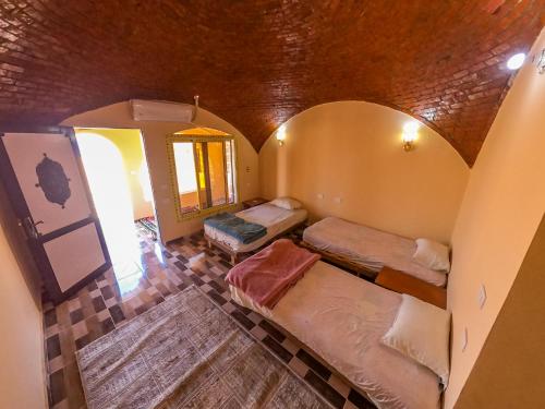 Una cama o camas en una habitación de Flight Mode Camp
