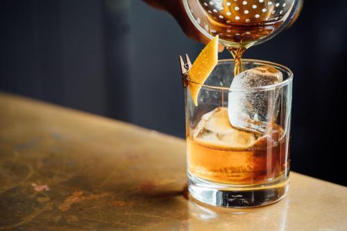 a drink being poured into a glass on a table at San Diego Marriott Gaslamp Quarter in San Diego