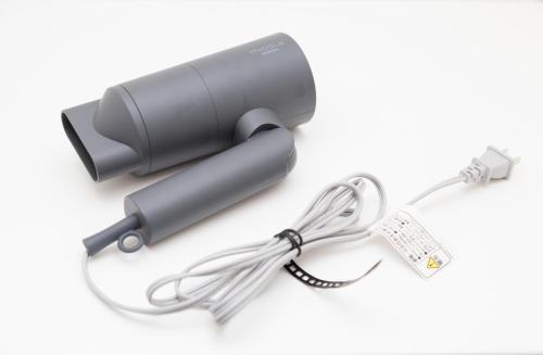 a flashlight with a cord and a charger at Residence Hotel Hakata 8 in Fukuoka