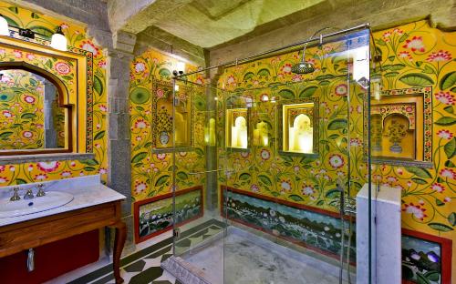 a bathroom with a shower and a sink at Gogunda Palace in Udaipur