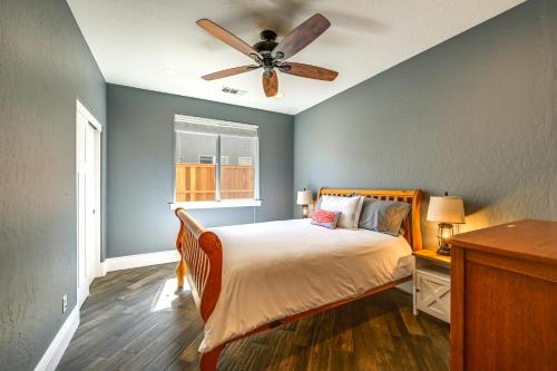 a bedroom with a bed and a ceiling fan at California Vacation Rental with Private Pool and Patio in Visalia