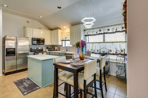 a kitchen with a table and some chairs in it at 4 Mi to ATandT Stadium Home with BBQ in Grand Prairie in Grand Prairie