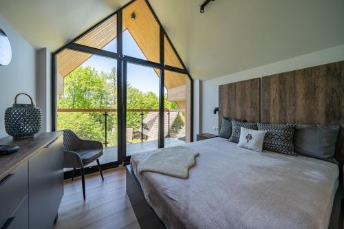 Postel nebo postele na pokoji v ubytování 100m2 z widokiem na Giewont
