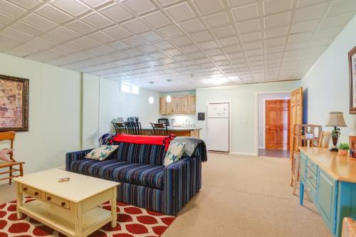 a living room with a couch and a table at Lockes Glen - Lakefront Geneva Getaway with Dock! in Geneva