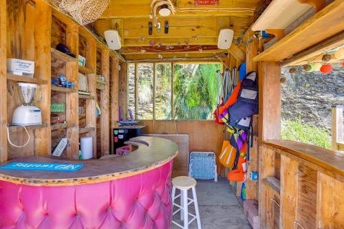 a bar in an rv with a pink counter at Lockes Glen - Lakefront Geneva Getaway with Dock! in Geneva