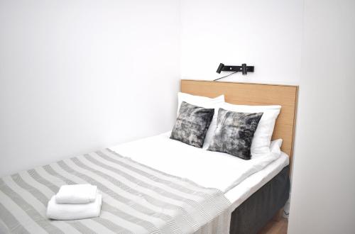 Кровать или кровати в номере Apartments Lund