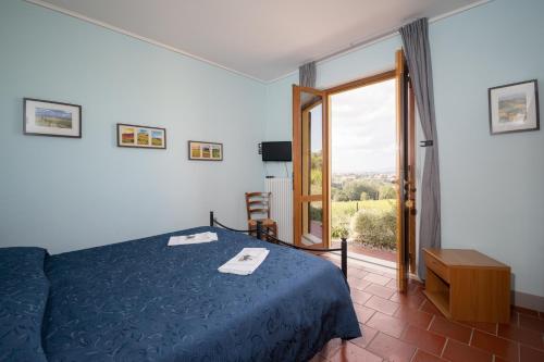 Postel nebo postele na pokoji v ubytování Agriturismo Metina