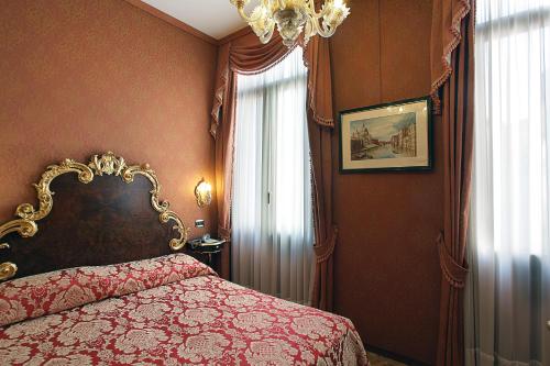 Postel nebo postele na pokoji v ubytování Hotel Ateneo