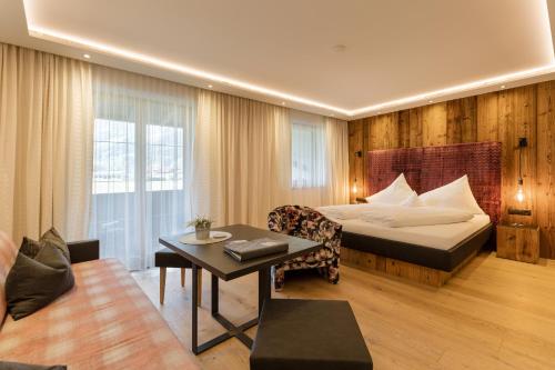 Postel nebo postele na pokoji v ubytování Hotel Garni Jagdhof