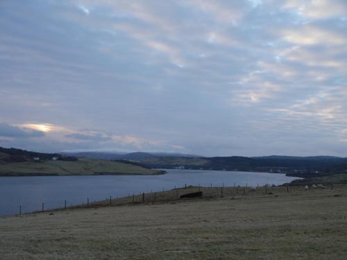 a large body of water with a fence next to it at 40 Bernisdale - The Sabhal in Skeabost
