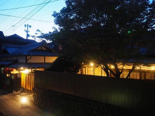 a fence in front of a house with lights at fumoku - Vacation STAY 04226v in Chino