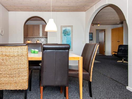 a dining room with a table and chairs at 6 person holiday home in Hvide Sande in Havrvig