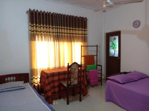 Postel nebo postele na pokoji v ubytování Muthu Villa Sri Lanka