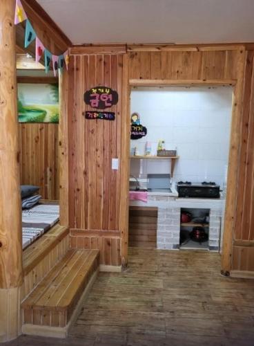 a room with a sauna with a bench in it at Yeongwol Healing Forest Pension in Yeongwol