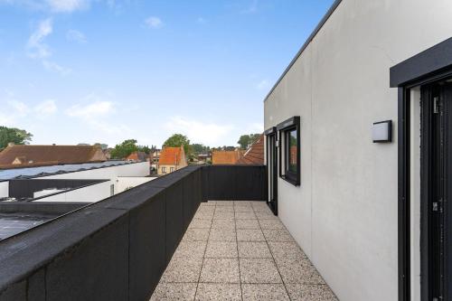 a view from the balcony of a house at Hof Ter Molen - Luxe kamer met privé badkamer in Diksmuide