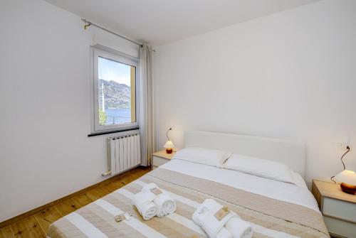 Giường trong phòng chung tại MGH - Malcesine Holiday Apartment