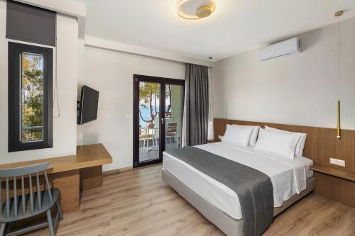 Ένα ή περισσότερα κρεβάτια σε δωμάτιο στο Villa Kelyfos