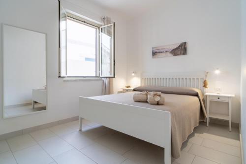 Postel nebo postele na pokoji v ubytování Casa Tuminello Granelli