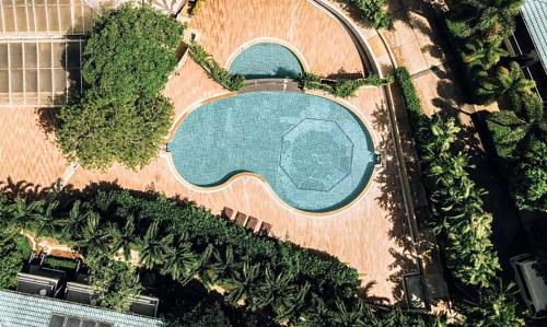 an overhead view of a swimming pool with trees at Wake Up Aonang Hotel- SHA EXTRA PLUS in Ao Nang Beach