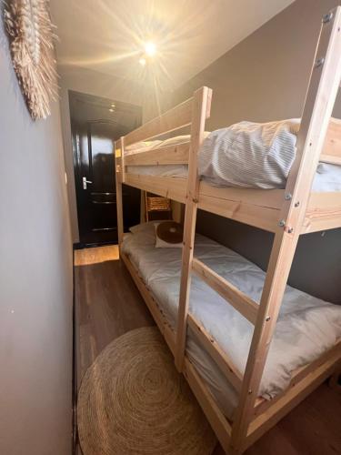 a couple of bunk beds in a room at Casa Xabia in Zaandam