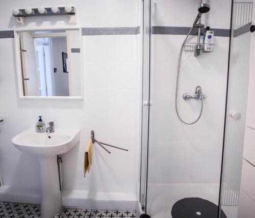a bathroom with a shower and a sink at Centergom in Esztergom
