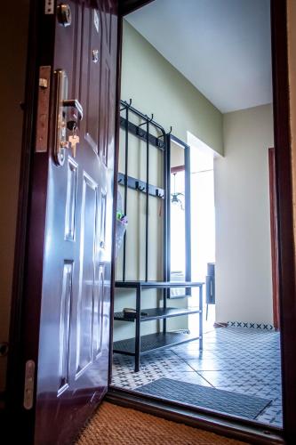 an open door to a room with a table in it at Centergom in Esztergom